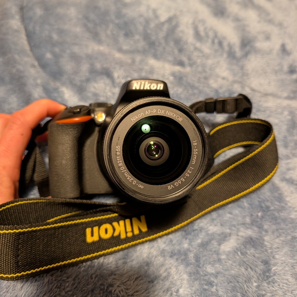 Nikon Black DSLR Camera with 4 Lenses
